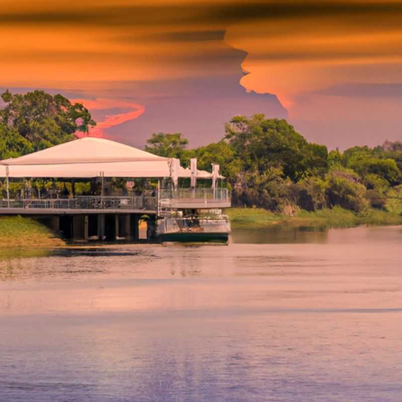 A group of six adventurers embark on a thrilling 24-hour expedition in Chobe National Park, Botswana, during the vibrant fall season, surrounded by the untamed beauty of nature and the promise of unforgettable wildlife encounters.