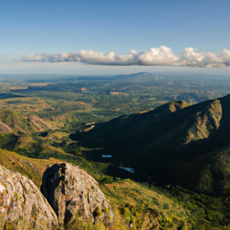 Six intrepid travelers stand tall against the imposing backdrop of Mount Mulanje in Malawi during their 4-day winter adventure. The mountain's rugged slopes and ethereal beauty provide a stunning backdrop for their exploration.