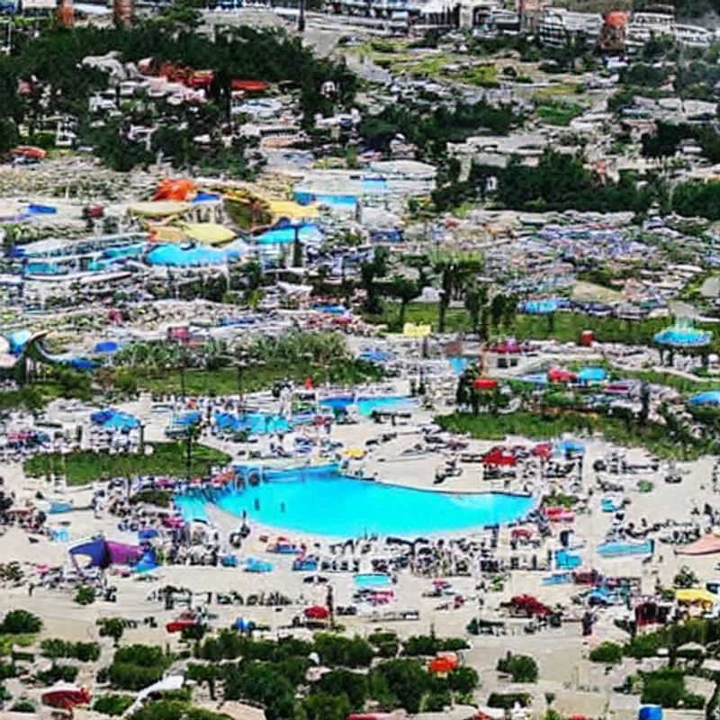 Golden savanna stretching as far as the eye can see in Serengeti National Park, Tanzania, teeming with wildlife under the African sun – a glimpse into the summer holiday adventure awaiting.