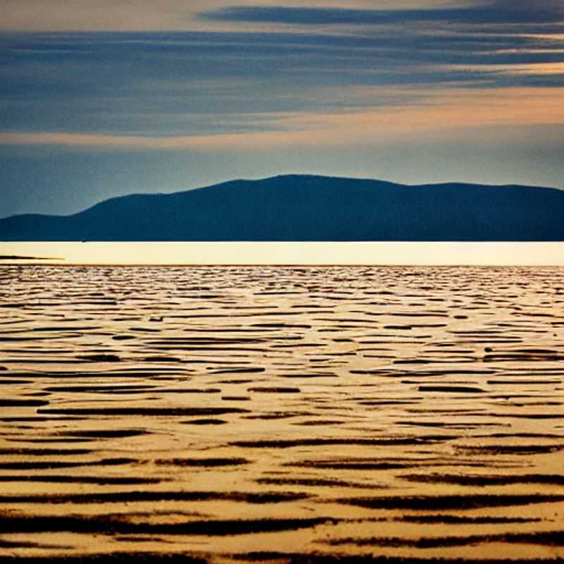 Vue imprenable sur le lac Tanganyika depuis un lodge de luxe, savourant les saveurs locales : l'escapade parfaite pour le voyageur gastronome en Tanzanie.