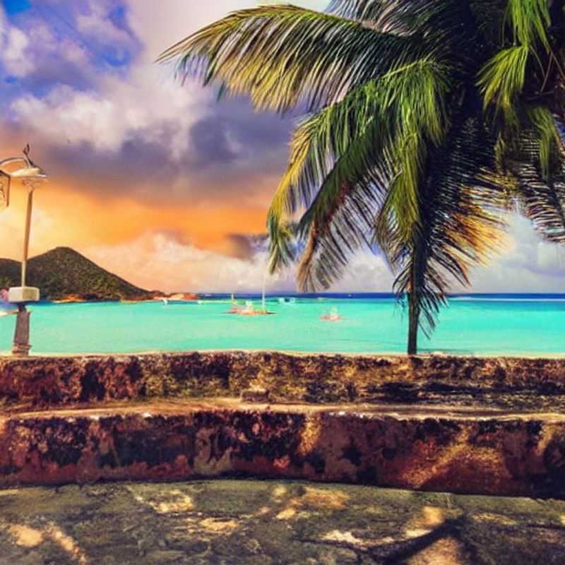 Plage immaculée d'Antigua, baignée de soleil, un joyau des Caraïbes idéal pour des vacances d'été luxueuses, où le sable blanc rencontre une mer turquoise étincelante.