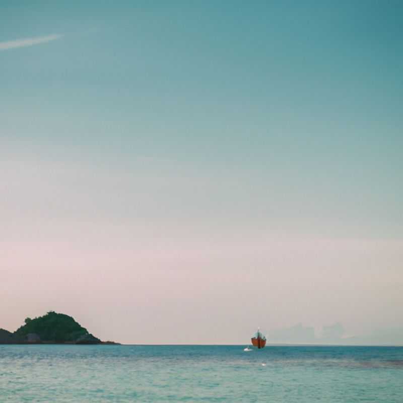 A couple of digital nomads soak up the vibrant energy of Koh Phangan, Thailand, during their 2-week summer retreat, embracing the island's pristine beaches, lush jungles, and vibrant nightlife.