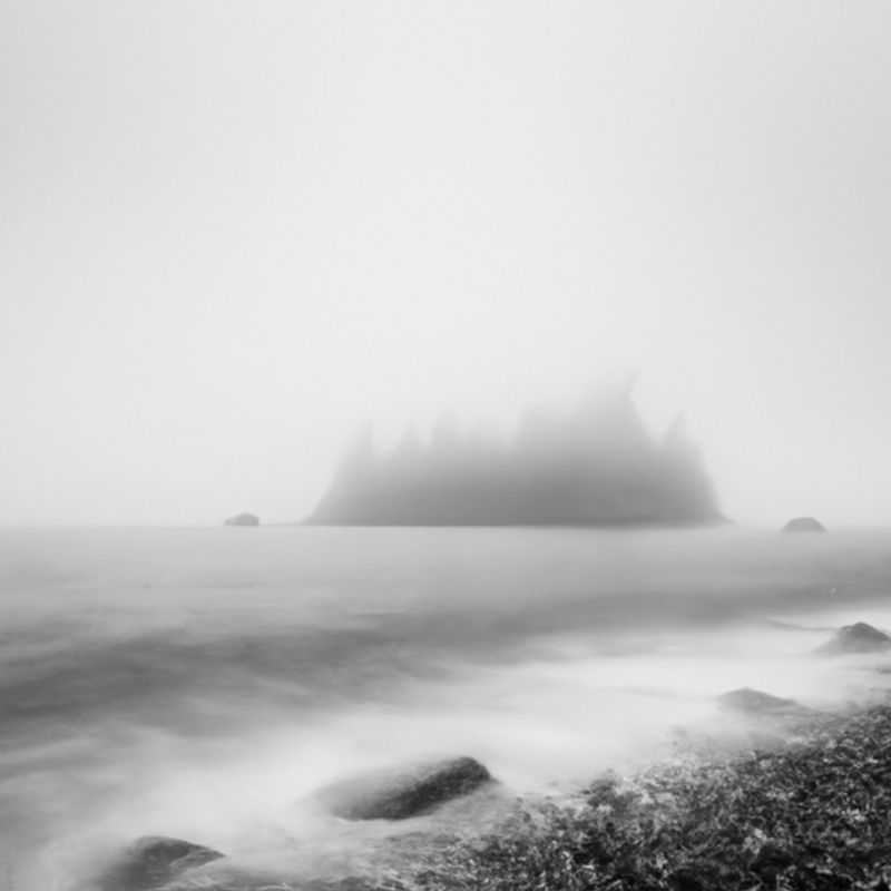 A solitary figure treks through the snow-laden wonderland of Juan de Fuca Trail, Canada, on a 3-week winter expedition, embracing the solitude and tranquility of the wilderness as a digital nomad.